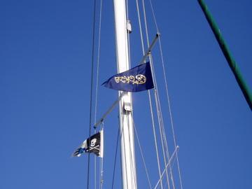 The Flicka and the Swallows and Amazons For Ever! burgees flying side by side on the Maritime in Yokohama.